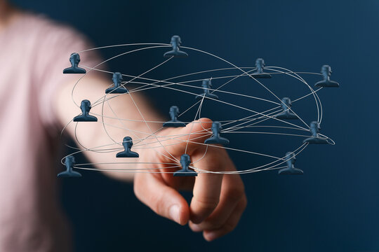 Abstract image representing a digital network, social connection, and communication concept. Finger pointing at the center of the network, visua