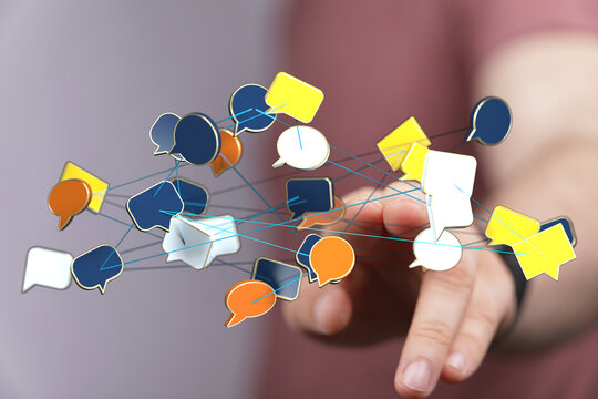 Hand touching network of speech bubbles suggesting communication, social media, connection, data sharing, brain