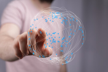 Person interacting with a digital network, concept of global connectivity, innovation, and technological advancement. Ideal for busin