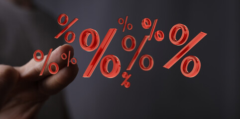 Stock photo of a hand with red percentage symbols, perfect for finance, sales, discount, and...