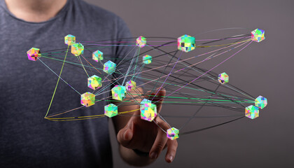 Concept of technology, connections, and digital network represented by person touching cubes with connecting li