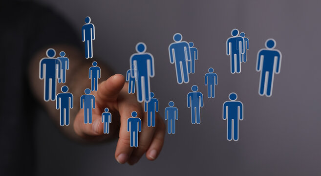 Hand pointing at a conceptual digital interface with people silhouettes, representing connectivity and social i