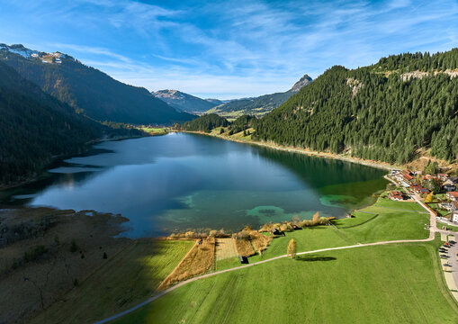 Aerial photo of Lake Haldensee in the Tannheim Valley with village oh Haller and Rote Fluh summit, Tyrol, Austria