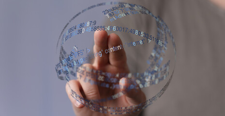 Hand touching digital globe symbolizing network and online data. Represents internet, technology, cloud computing, and communication.
