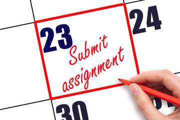 23 rd day of the month. Hand writing Submit assignment reminder and drawing red frame on calendar with red pen on white background. Business concept. Planning and scheduling