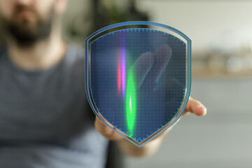 Hand holding a futuristic digital shield, symbolizing internet security, data protection, and...