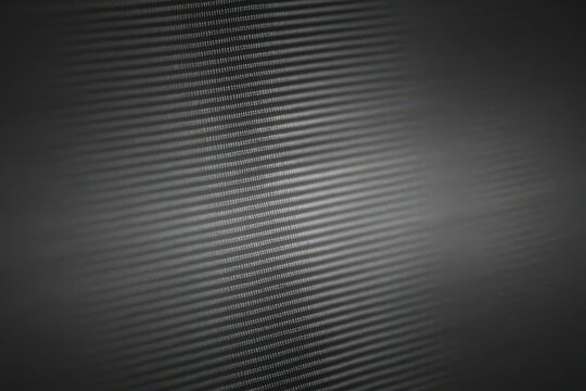 Fine CRT/monitor scanline texture in grayscale, subtle moiré, faint glow, shallow depth of field macro aesthetic.