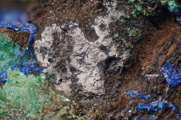Azurite and Malachite mineral specimen from Kamenushinskoe deposit — vibrant blue and green crystals with earthy matrix under magnification — professional macro, micro mineral photography