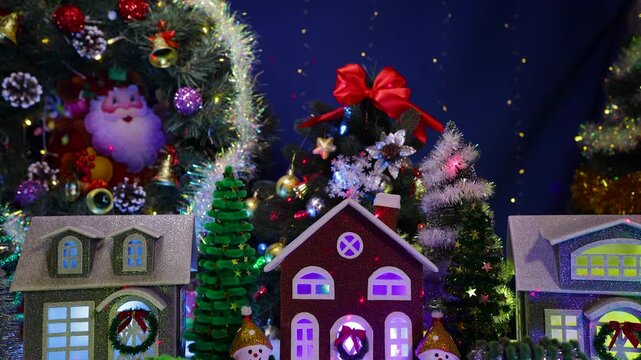 In the center of the Christmas village there is a brown house with letters in front