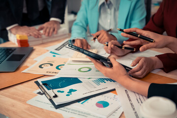 Naklejka premium Businessman and team analyzing statistics with documents and graphs. Accounting consultant dealing with data, budget and profit chart for company. Close up.