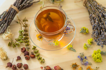 Herbal tea with medicinal herbs and flowers. Selective focus.