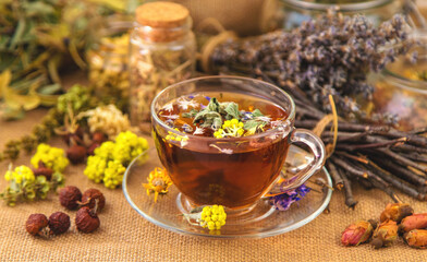 Herbal tea with medicinal herbs and flowers. Selective focus.