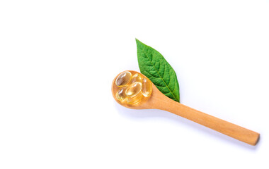 Oil capsules supplements isolate on white background. Selective focus.