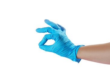 A hand wearing a light blue glove forms an okay gesture against a white background, indicating a positive affirmation or safety measure in a clean environment.