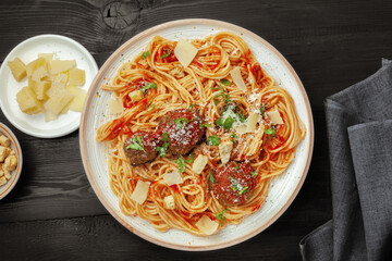 Overhead Shot of Spaghetti with Meatballs In Red Tomato Sauce With Parmesan.