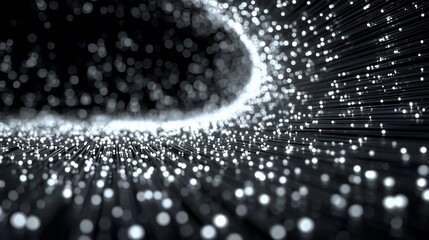 Abstract black and white light streaks leading to a bright bokeh tunnel effect