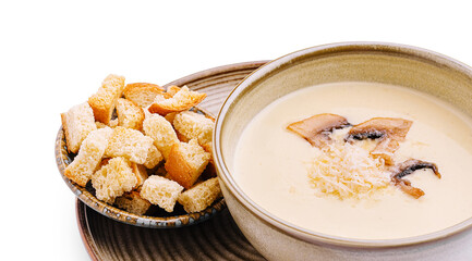 Delicious creamy mushroom soup served with crispy bread cubes for a perfect meal