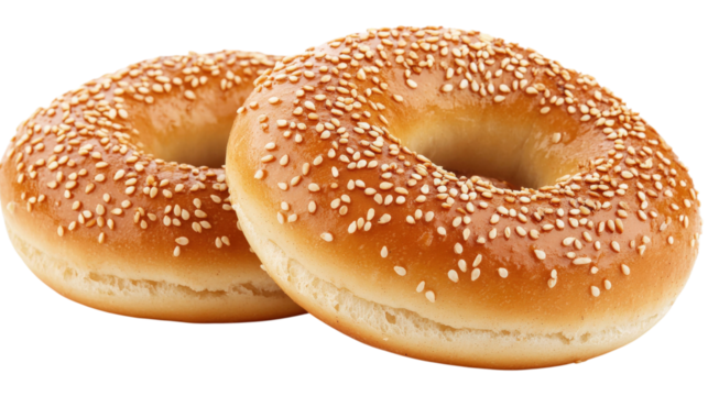Two Sesame Seed Bagels isolated on a transparent background