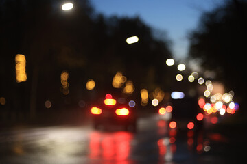 Fototapeta premium Night city blurred background, bokeh in autumn city traffic cars