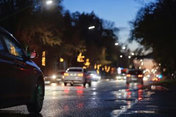 Obraz premium Night city blurred background, bokeh in autumn city traffic cars