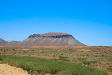 Panoramic view of a table mountain in the beautiful, typical Namibian landscape. Taken on the C13 between Helmeringhausen and Aus. Namibia, Africa.