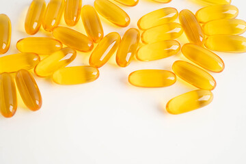 Fish oil or Cod liver oil gel in capsules with omega 3 vitamins, supplementary healthy food.