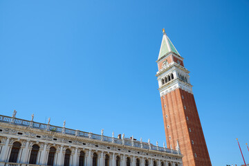 Red brick tower known as Campanile, St. Mark's Square in Venice.