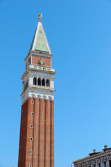 Red brick tower known as Campanile, St. Mark's Square in Venice.