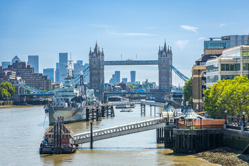 Tower bridge, river Thames and HMS Belfast cruiser boat on a sunny afternoon in London