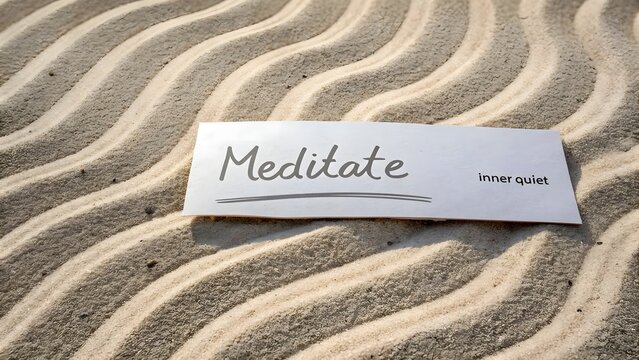 A note showing Meditate on sandy rippled beach