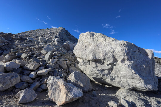 Large lithium (Li) ore rocks. Mine producing spodumene concentrate, Li carbonate and hydroxide. Lithium-ion batteries for electric vehicles and grid-scale storage for renewable energy