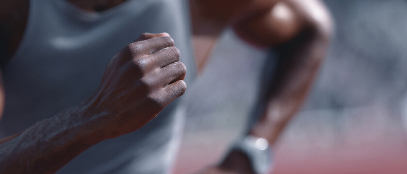 Close up of athlete hand in motion wearing smart wearable device
