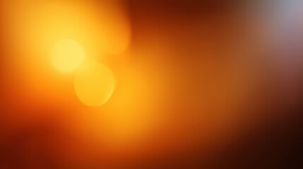 Abstract warm bokeh background with soft orange and yellow glows on a gradient from light to dark brown. Blurry circles create a serene, ethereal atmosphere, blurred orange background