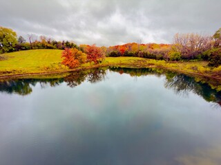 Minnesota Lake in the autumn with colorful trees reflection in water. 