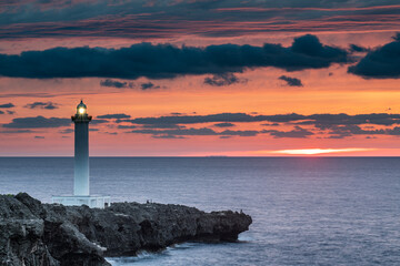A beautiful lighthouse as the sun goes down