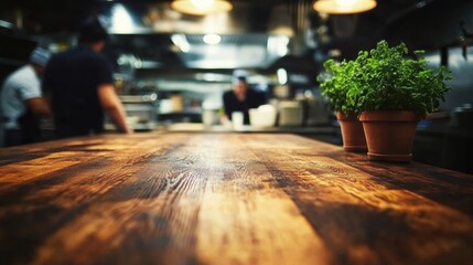 Long wooden table restaurant bar is made dark busy chefs working
