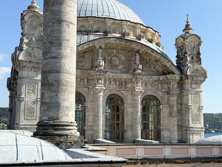 Detailed exterior view of Ortakoy Mosque with ornate stonework and historic Ottoman architecture