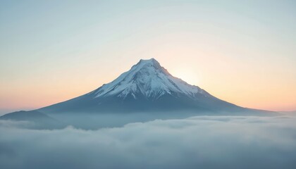 Snow capped mountain peak emerges from sea of clouds at sunrise. Majestic volcano summit rises above mist layer. Sky glows with soft orange and pink hues. Serene dawn breaks over landscape.
