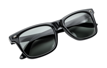 Close-up of black sunglasses with square frames.  The lenses are a dark gray or smoky tint, and the frames are glossy black plastic.  The sunglasses are angled, showing both the front and sides