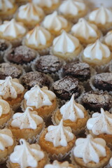 Assorted mini desserts with brownies, suspiros, and passion fruit pie—sweet, colorful treats perfect for any occasion.