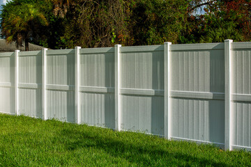White Vinyl Fence Solid Privacy with water drops after rain