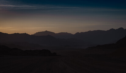 rocky mountains and desert landscape and sunset sky in Egypt