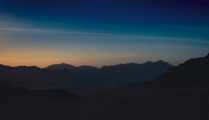 rocky mountains and desert landscape and sunset sky in Egypt