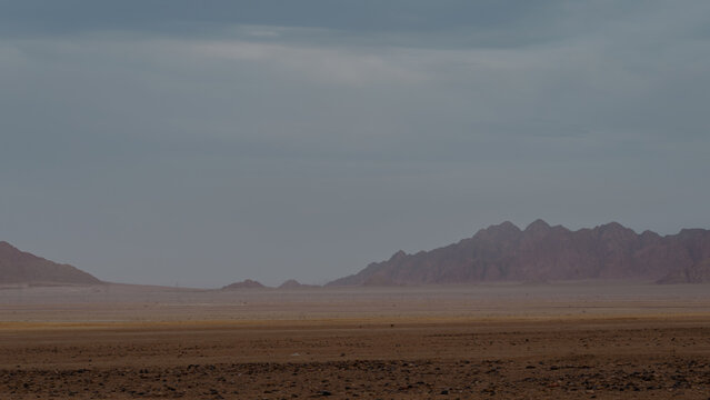 rocky mountains and desert landscape and sunset sky in Egypt