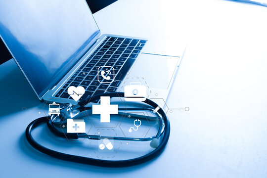 Healthcare technology (HealthTech) concept. Stethoscope on laptop with virtual medical icons. Telemedicine, digital health, and electronic health record (EHR) innovation. - Powered by Adobe