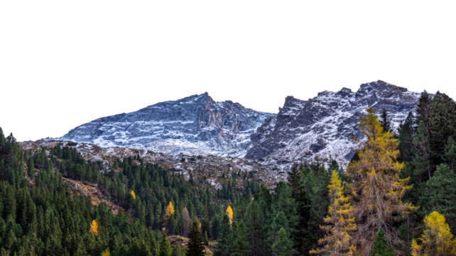 Lightly snow-capped mountains against a backdrop of green and yellow fir trees. Isolated on a transparent background. Autumn/winter mountain landscape. PNG