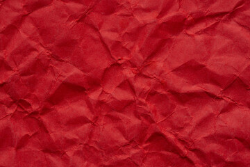 Macro crumpled red paper background,Bright red crumpled paper background,Red crumpled paper texture macro,Red crumpled paper as a texture or background. Bright red crumpled paper for backgrounds,
