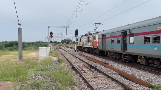 Indian Railway Train on Track Passing Through Countryside