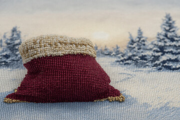 closeup of santa bag brimming with colorful gifts set against snowy landscape