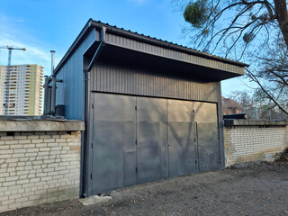 Fototapeta premium Premises for a car service station. The service station has large metal doors